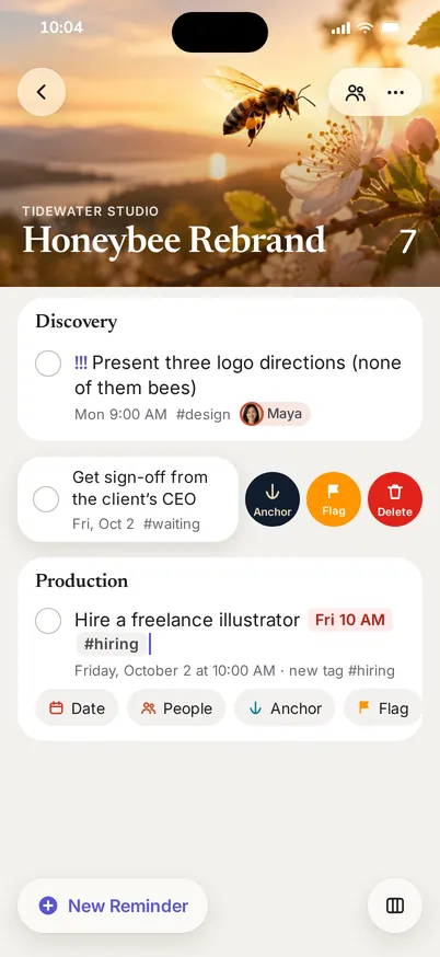 A list on iPhone with a cover photo and swipe actions to anchor, flag or delete a reminder.